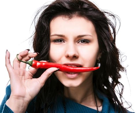 Premium Photo Woman Holding Red Hot Chili Pepper In Mouth