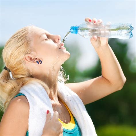 Woman Drinking Water After Exercise Stock Photo By ©markin 19977467