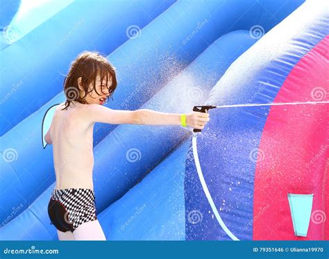 Boy In Swimming Slip In Aquapark Water Spray Stock Photography
