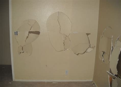 Holes Punched In Damaged Drywall Restoration Services Waves Before