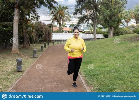 Curvy Woman Jogging Outdoor At City Park Focus On Face Stock Image Image Of Muscular Latin