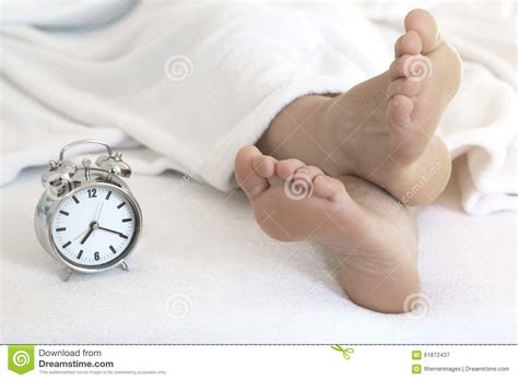 Naked Feet In Bed With Alarm Clock Stock Image Image Of Sole Foot