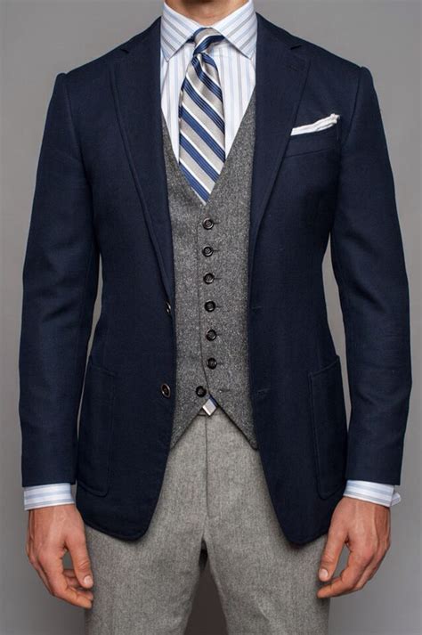 navy blazer grey tweed vest light grey wool pants blue striped tie blue and white striped