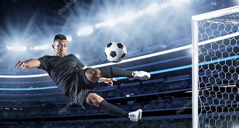 Hispanic Soccer Player Kicking The Ball Stock Photo By Yobro