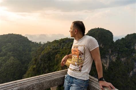 Young Man Standing In Tiger Cave Temple View Point And Looks From The