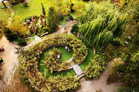 Female golfer playing miniature golf. A Minnesota Sculptor Creates a Mini-Golf Course in His ...