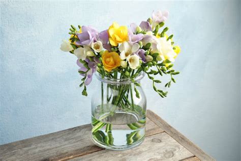 Bouquet Of Fresh Freesia Flowers In Glass Vase Stock Photo Image Of