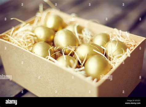 Golden Easter Eggs In Container Stock Photo Alamy