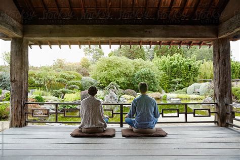 Couple Looking At View And Meditating At Japanese Spa By Stocksy Contributor Trinette Reed