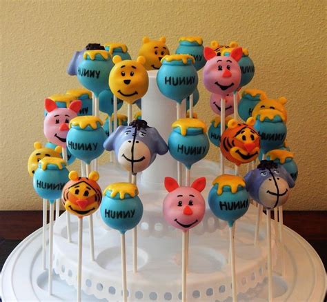 This winnie the pooh birthday cake reminds me of the movie when pooh bear is being the little black rain cloud and is flying up, up to the honey tree. Winnie the Pooh and Friends Cake Pops | Winnie the pooh ...