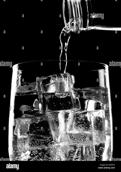 Bottle Of Soda Mineral Water Pouring Into Glass Stock Photo Alamy
