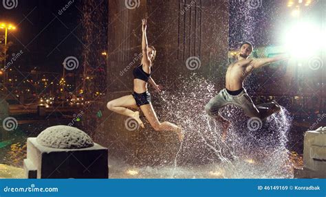 Attractiveain Athletes Jumping In The Fountain Stock Image Image Of Force Muscle