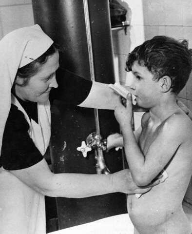 Germany Unrra Peter Gets A Bath Before His Medical Exam Nurse Paluojs Livi Sees That