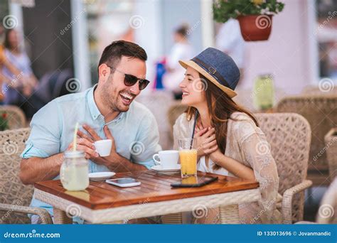 Beautiful Loving Couple Sitting In A Cafe Enjoying In Coffee Stock