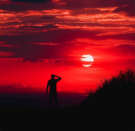 Silhouette Of Man During Red Sun Wallpaperhd Nature Wallpapers4k