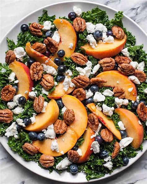 Summer Kale Salad With Peaches Blueberries Goat Cheese And Candied