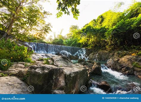 The Waterfall In The Forest And Sunrise In The Morning Stock Photo