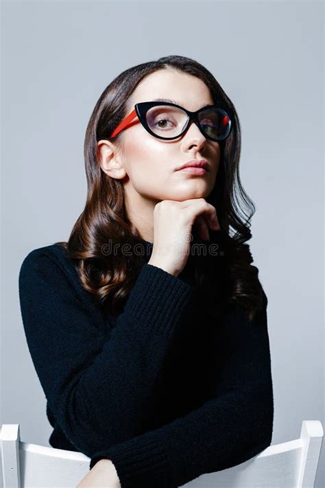 Young Beautiful Business Woman In Stylish Glasses Posing In Studio