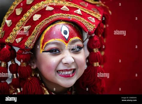 A Young Girl Dressed As The Living Goddess Kumari Takes Part In The