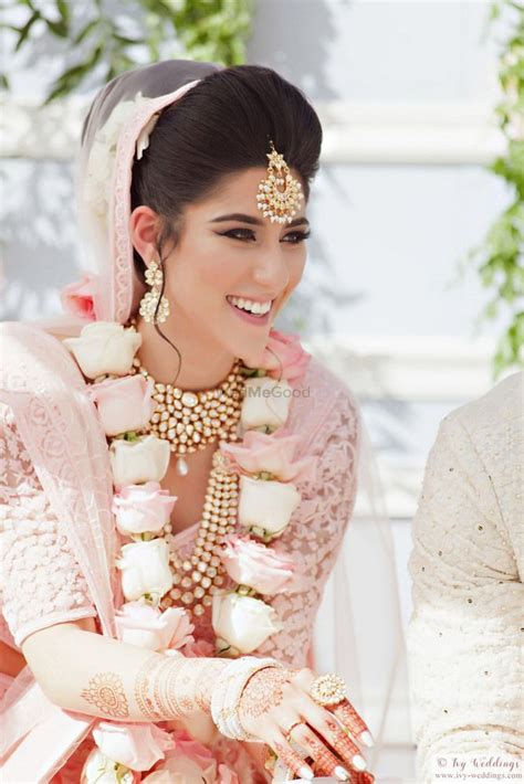 photo of happy bride shot with matching pastel jaimala bride wedding dresses for girls