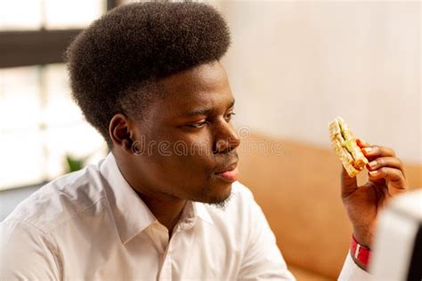 Nice Serious Man Holding His Tasty Sandwich Stock Image Image Of