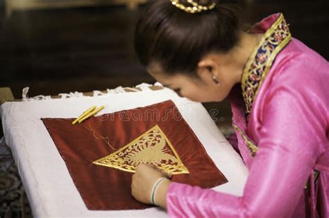 Traditional Isan Thai Silk Weaving Asian Woman Embroidering Golden