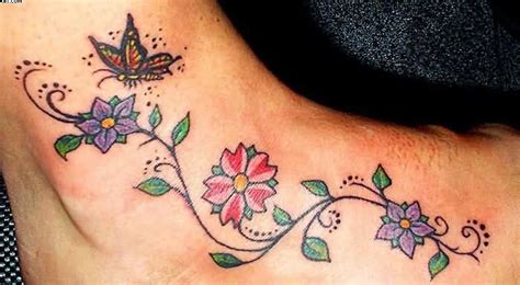 Color Flowers And Butterfly Vine Tattoo On Foot Vine Tattoos Tattoos For Women Flowers