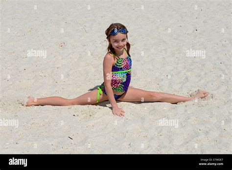 Young Girl Doing The Splits On The Sand At A Beach Stock Photo Alamy