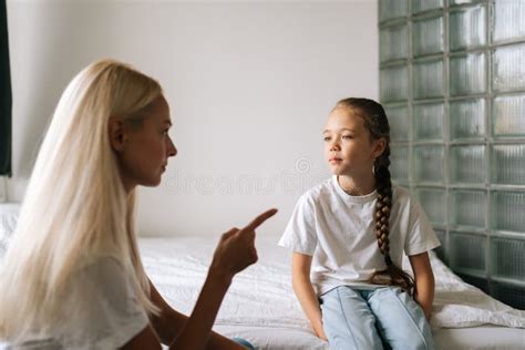 Side View Of Angry Young Mother Scolding Raising Voice Scream And