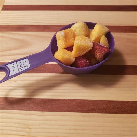 Tropical fish tacos recipe photo, roberto caruso and sian richards. frozen fruit in measuring cup tropical fruit smoothie ...