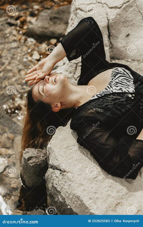 Woman Lies On The Beach Near The Water In Sunny Weather Long Be Stock Image Image Of Girl
