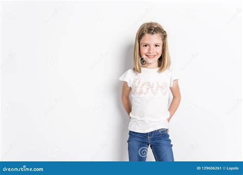 Portrait Of A Cute 7 Years Old Girl Isolated Over White Background