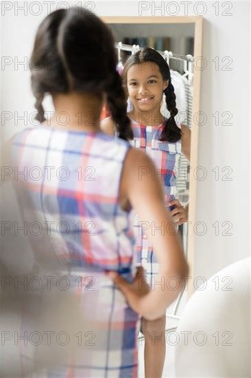 Reflection Of Mixed Race Girl In Mirror Photo12 Tetra Images Jgi Jamie Grill