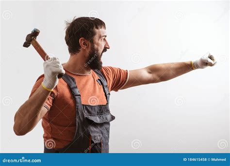 Bearded Builder Working With Hammer Construction Work Stock Photo