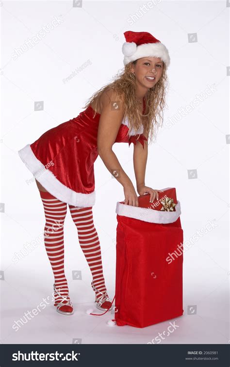 Sexy Blonde Female Santa In Red Dress With Stripped Stockings Bending