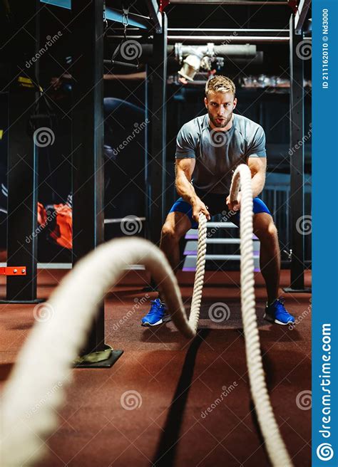 Fitness Man Working Out With Battle Ropes At Gym Stock Photo Image