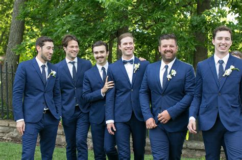 The Groomsmen Wore Blue Handm Suits With Blue And White Polka Dot Ties