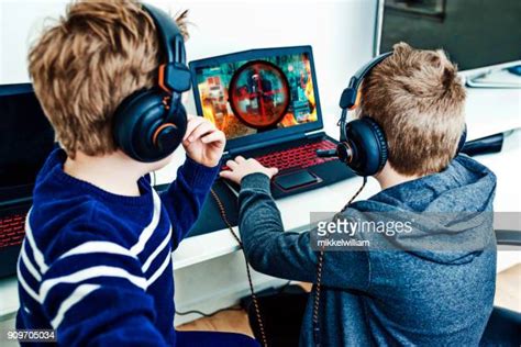 Kids Playing Video Games Laptop Photos And Premium High Res Pictures