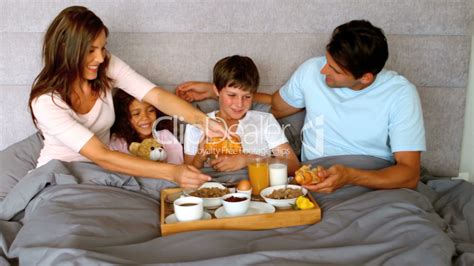 Family having breakfast in bed: Royalty-free video and stock footage