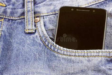 Modern Smartphone In The Pocket Of Jeans Close Up Cell Phone In The