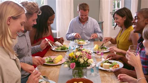 Follow these simple rules for placing different personality types around your table. Camera Tracks Across Table As Extended Family Sit And ...