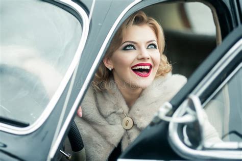 Retro Smiling Woman In Vintage Car In Travelling Happy Pinup Model