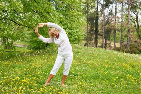 Senior Woman In White Stretching Arms Stock Image Image Of Dandelion