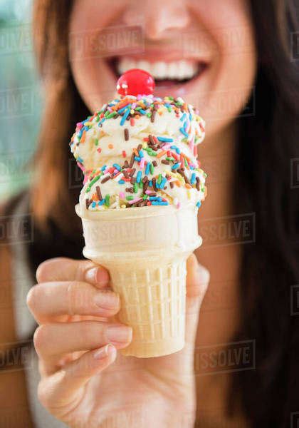 Close Up Of Woman Holding Ice Cream Cone Stock Photo Dissolve