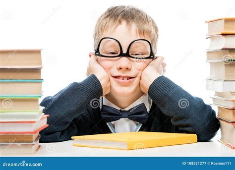 Funny Schoolboy And Piles Of Books On White Background Close Up