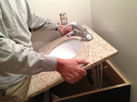 Next, put a thin bead of silicon around the lower lip of the sink and. How to Replace and Install a Bathroom Vanity and Sink