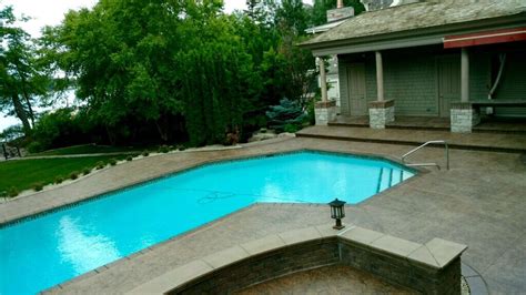 Stamped And Colored Concrete Pool Deck With Custom Cantilevered Concrete Coping By Sierra