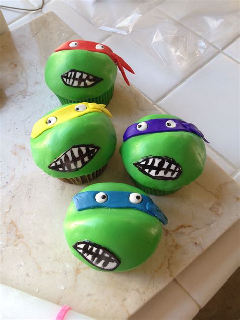 Four Cupcakes Decorated To Look Like Teenage Mutant Ninja Turtles