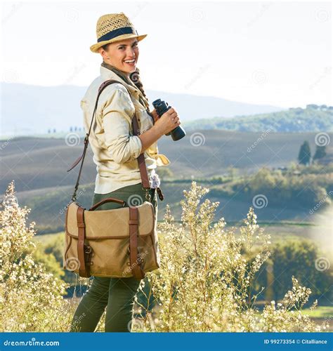 Smiling Adventure Woman Hiker Hiking In Tuscany With Binoculars Stock