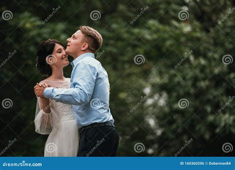 Bride And Groom At Wedding Day Walking Outdoors On Spring Nature Bridal Couple Happy Newlywed
